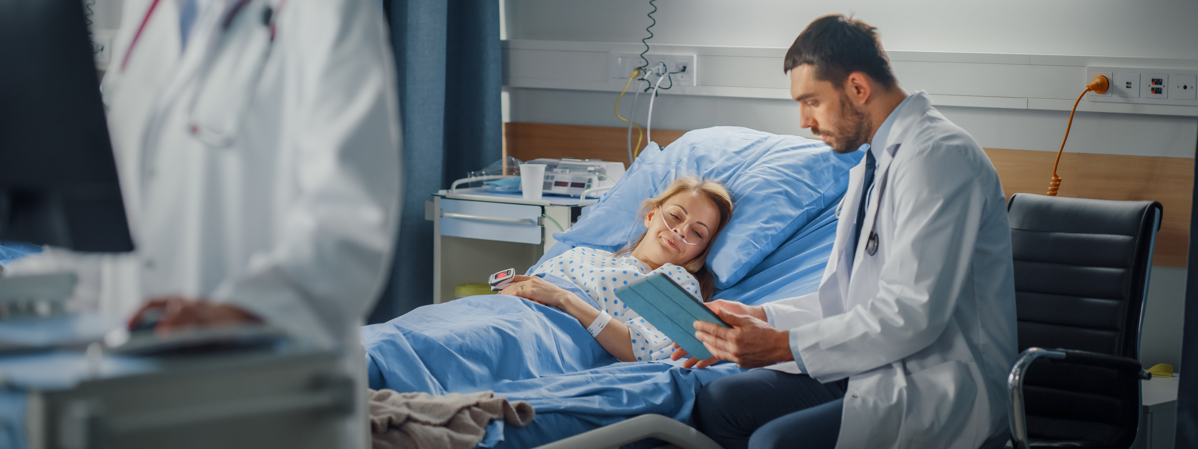 doctor at patient bedside