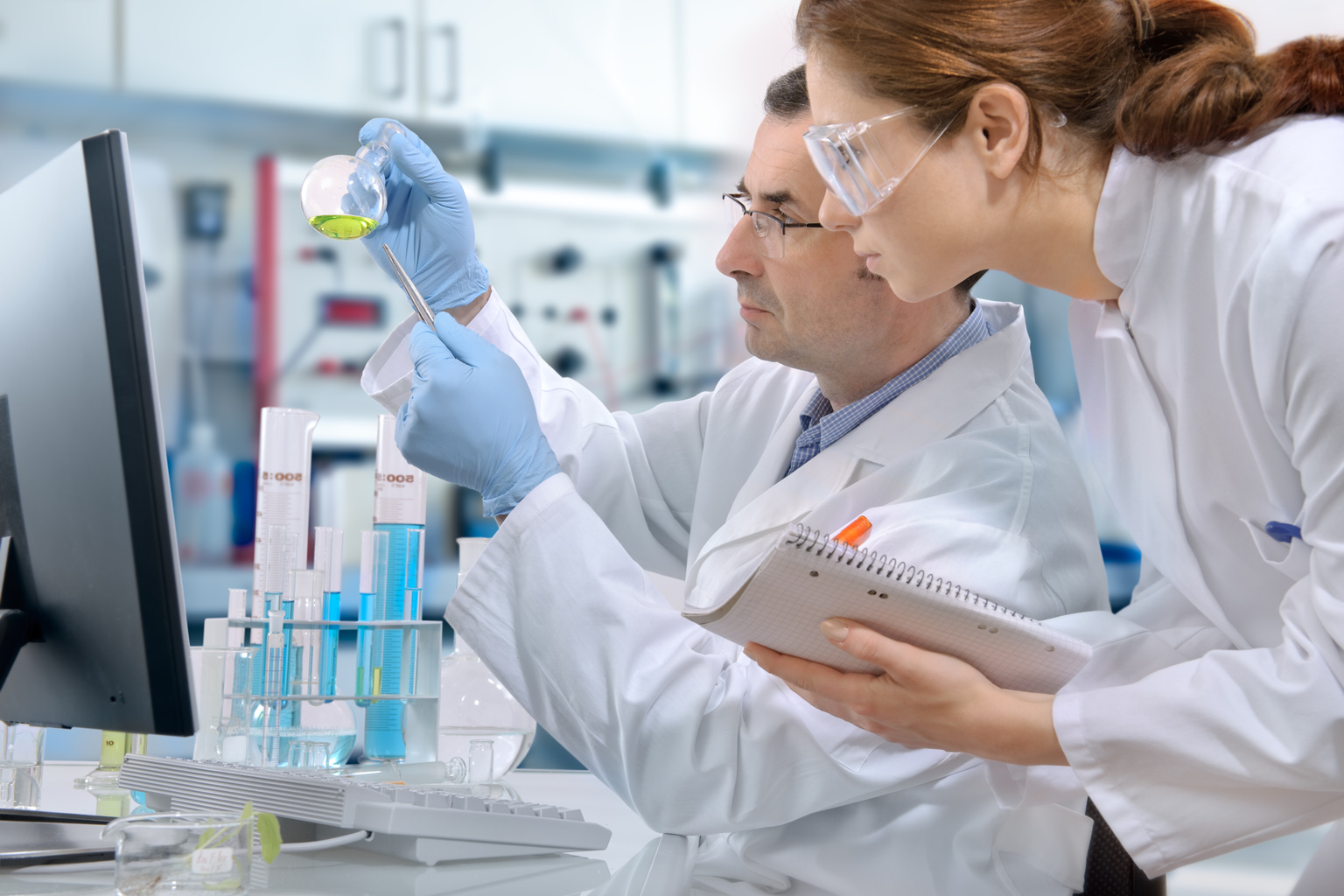 Two healthcare professionals conducting research in a lab