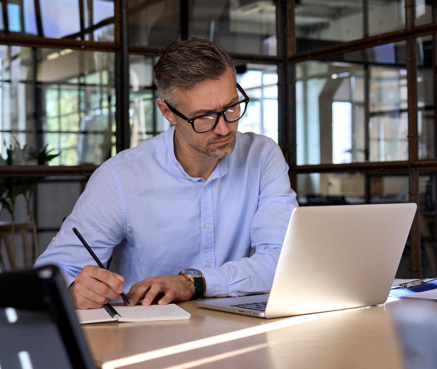 businessman w laptop at office