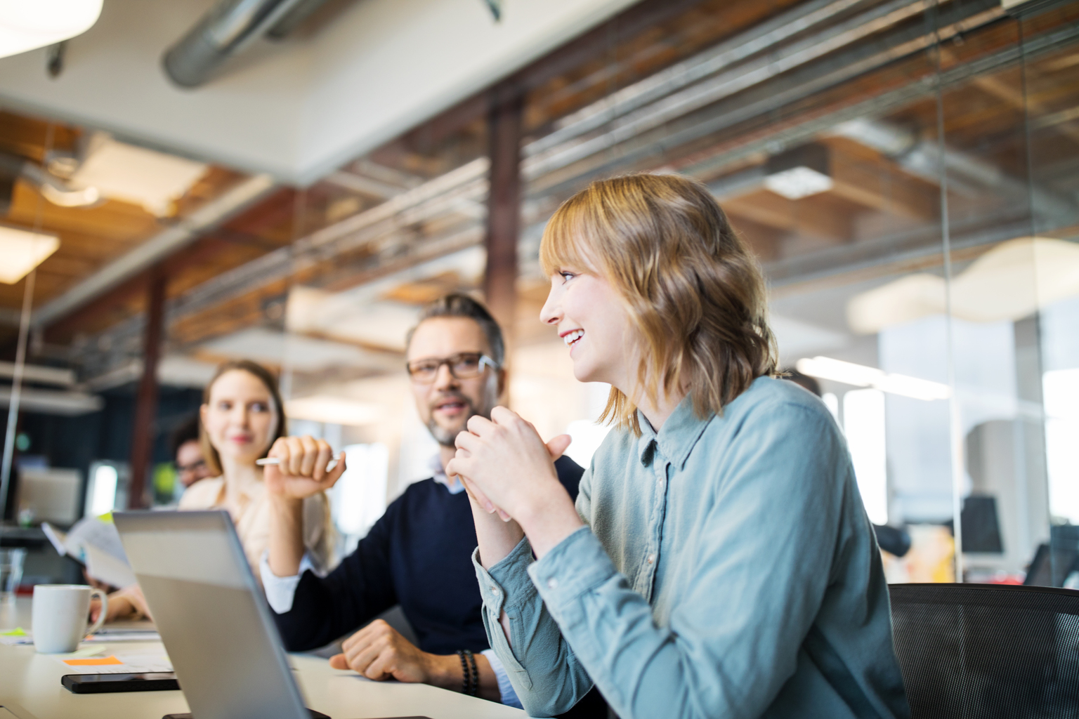 Woman Smiling in a Meeting