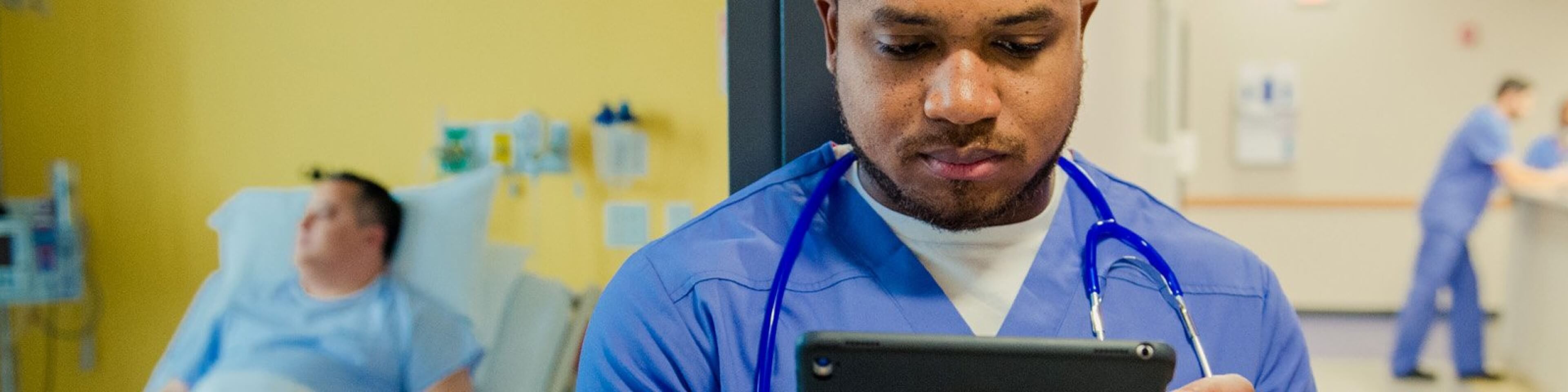 Doctor looking at patient data on a tablet