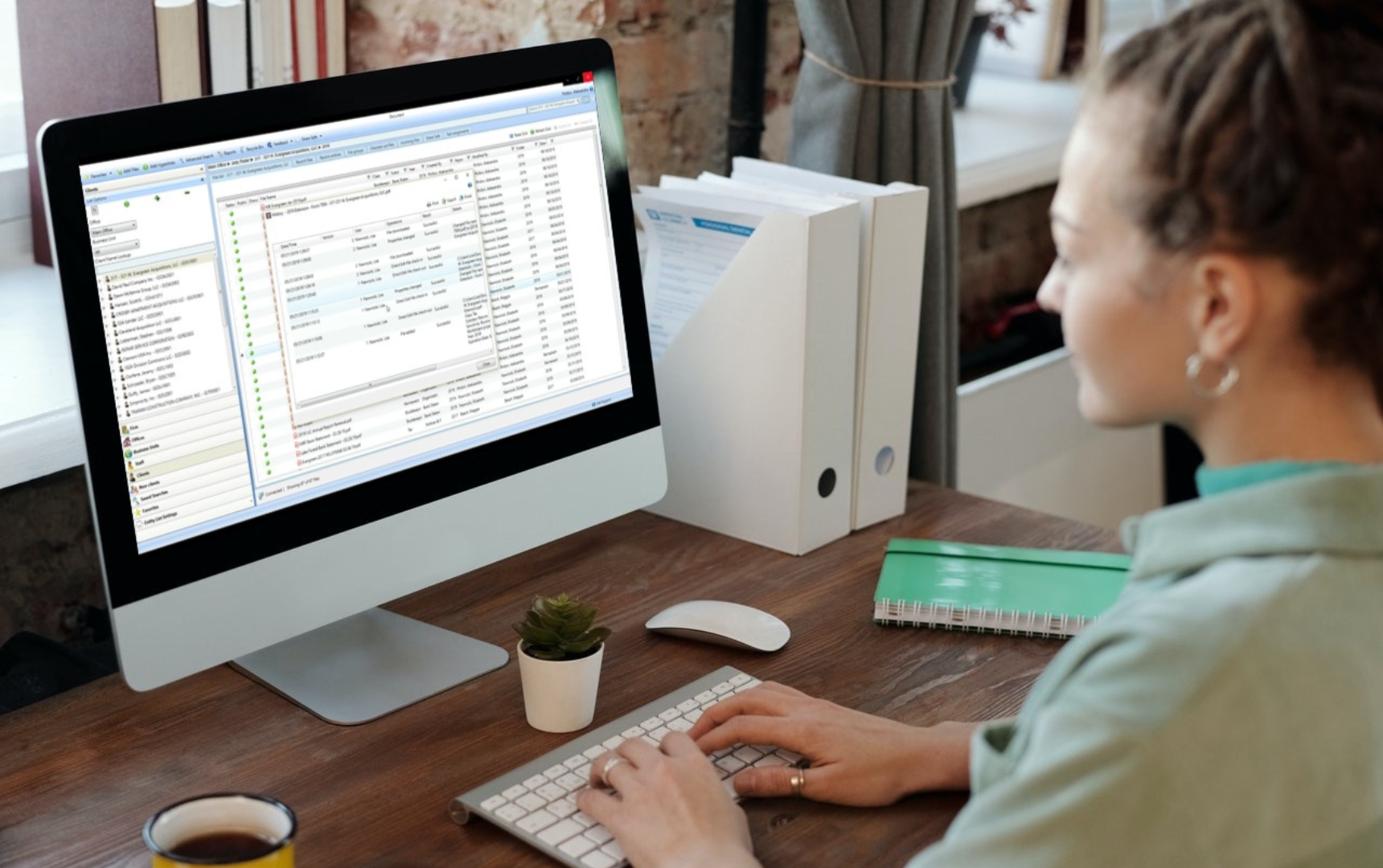 Woman working on computer spreadsheets