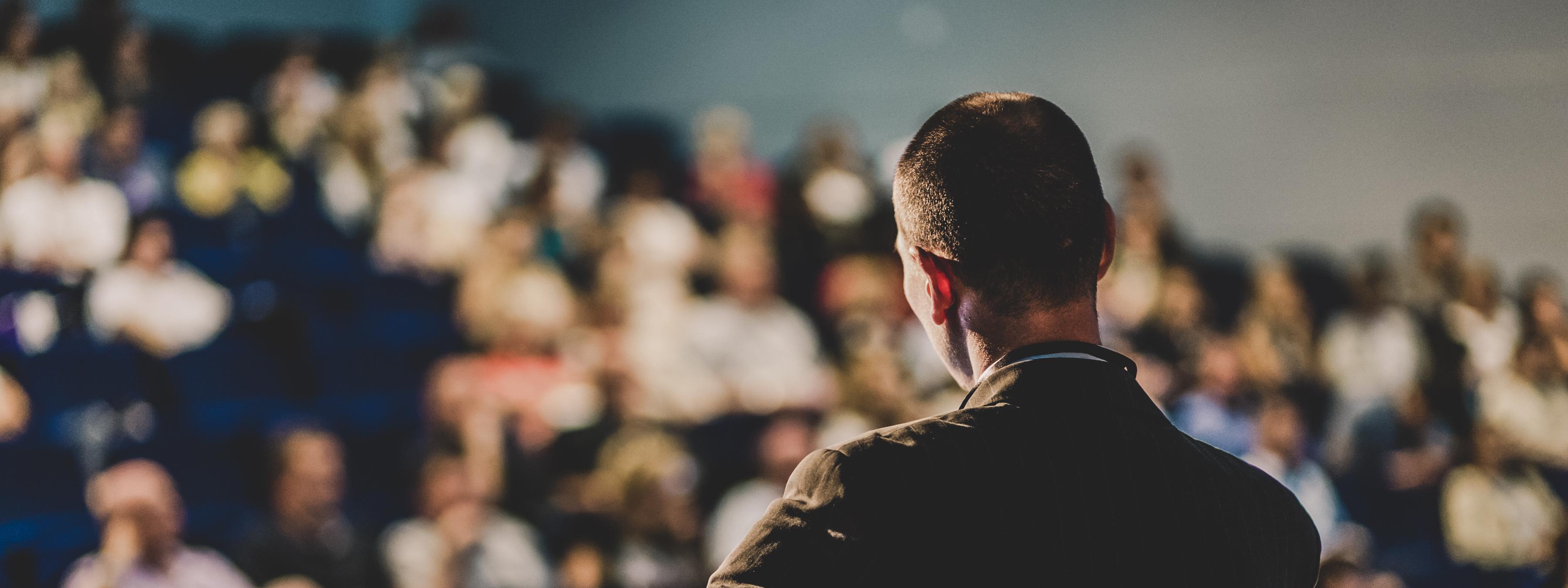 Crown Man talking audience conference