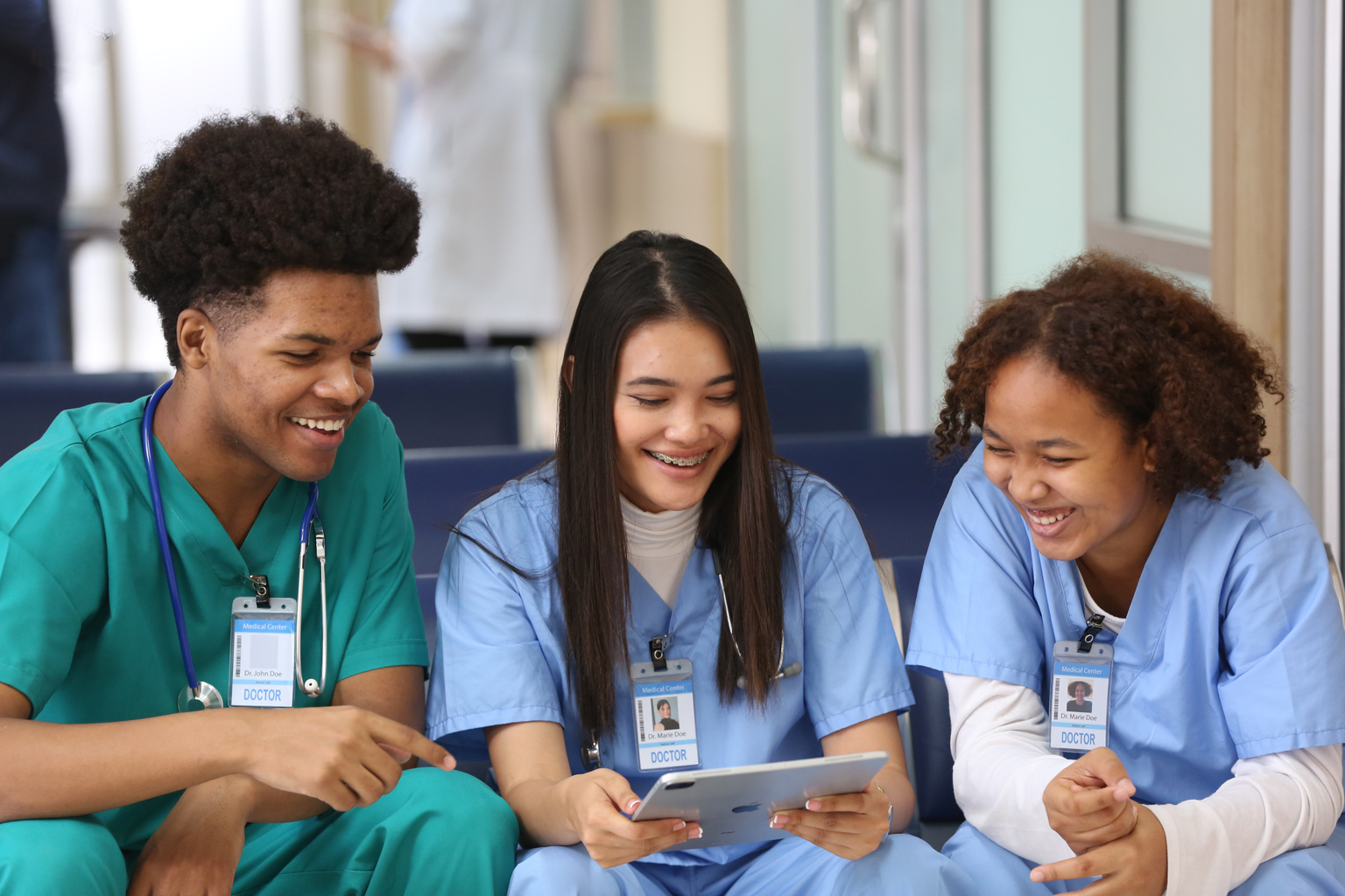 Group of smiling young doctors and nurses working at the hospital together