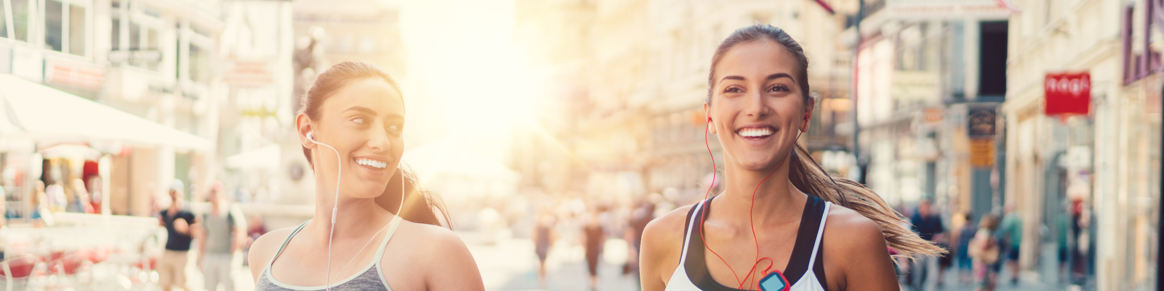 Two girls jogging in the city. Sport in Vienna