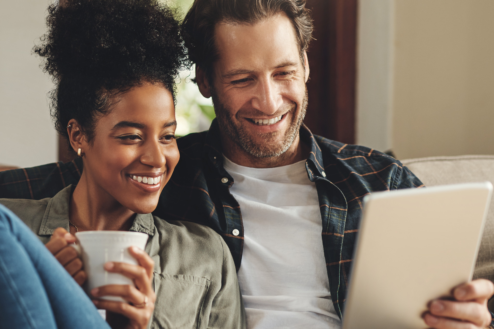 Couple looking at tablet device