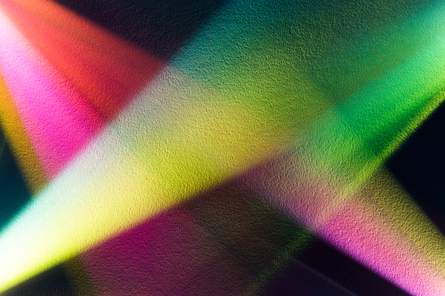 Colorful Light Beam Shining on Paper Texture Directly Above View