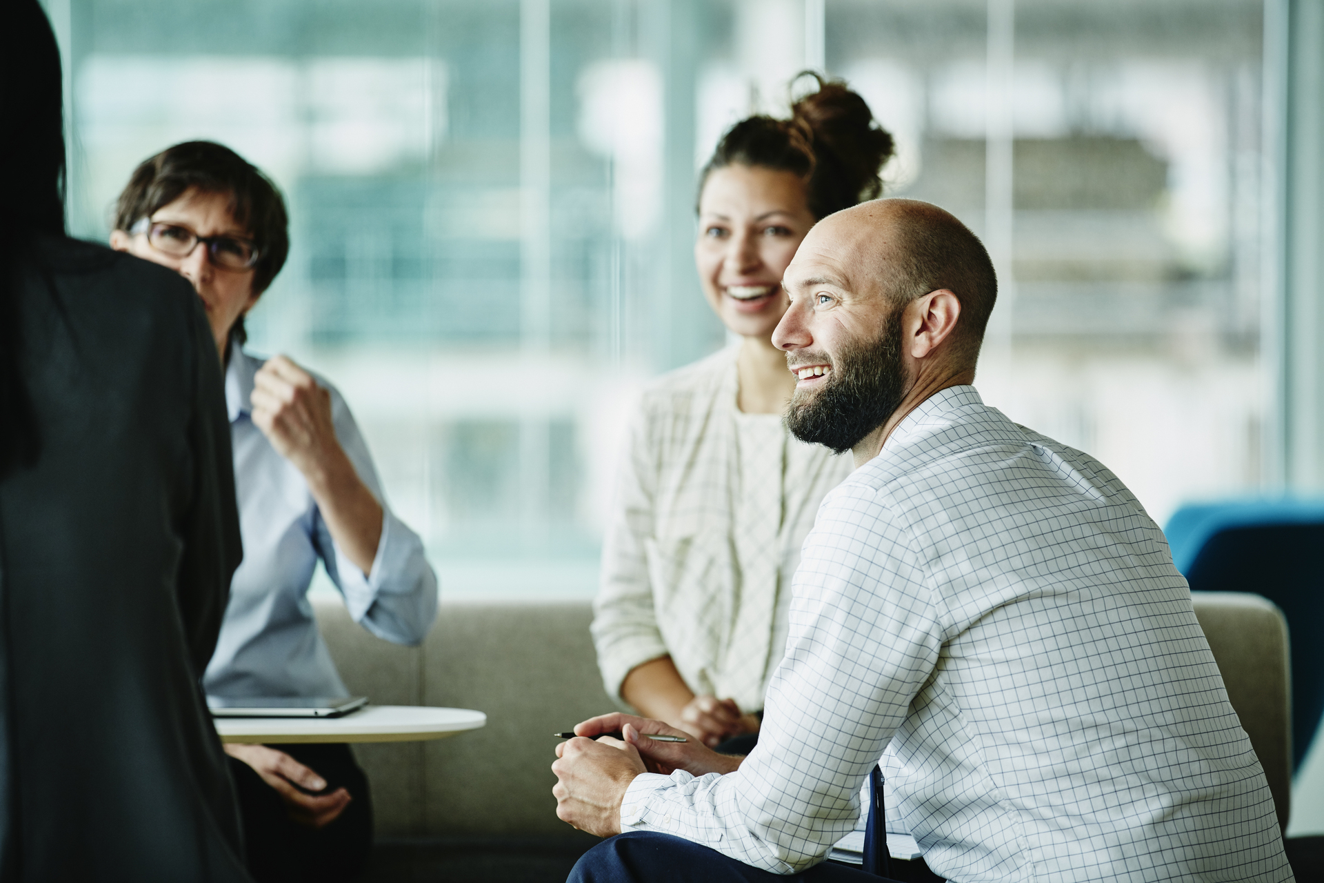 Businessman in office discussion with colleagues.