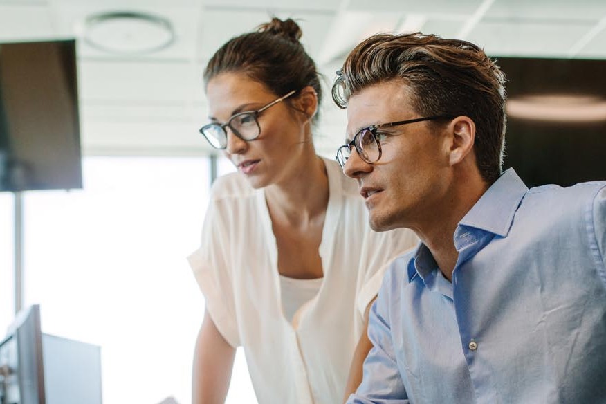 two people looking at a computer screen