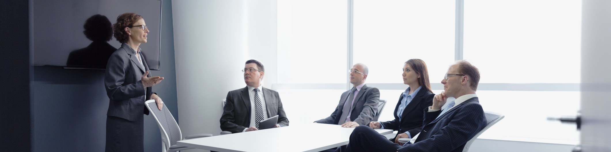 Businesswoman leading group meeting in office