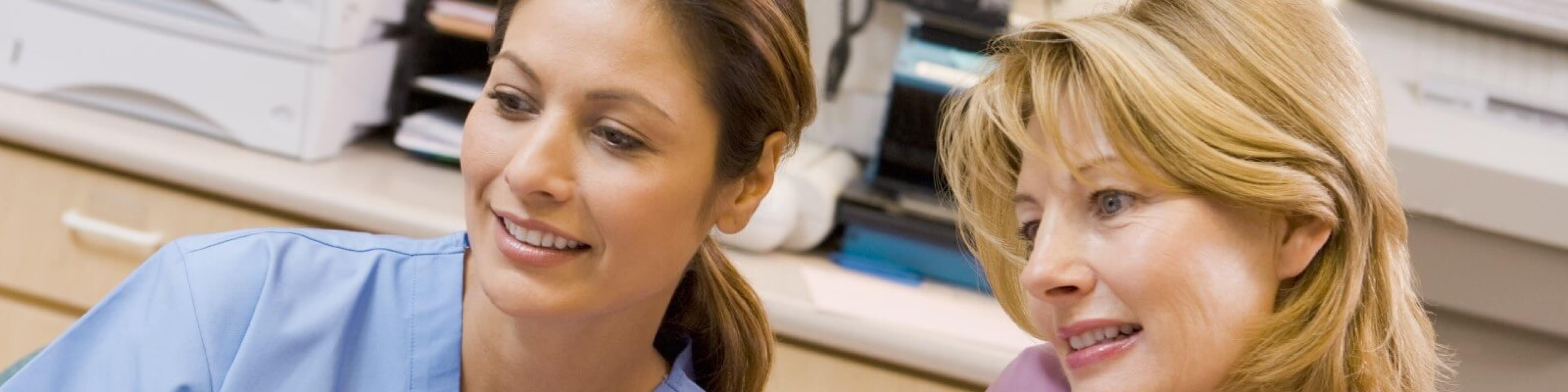 Nurses working together at nursing station