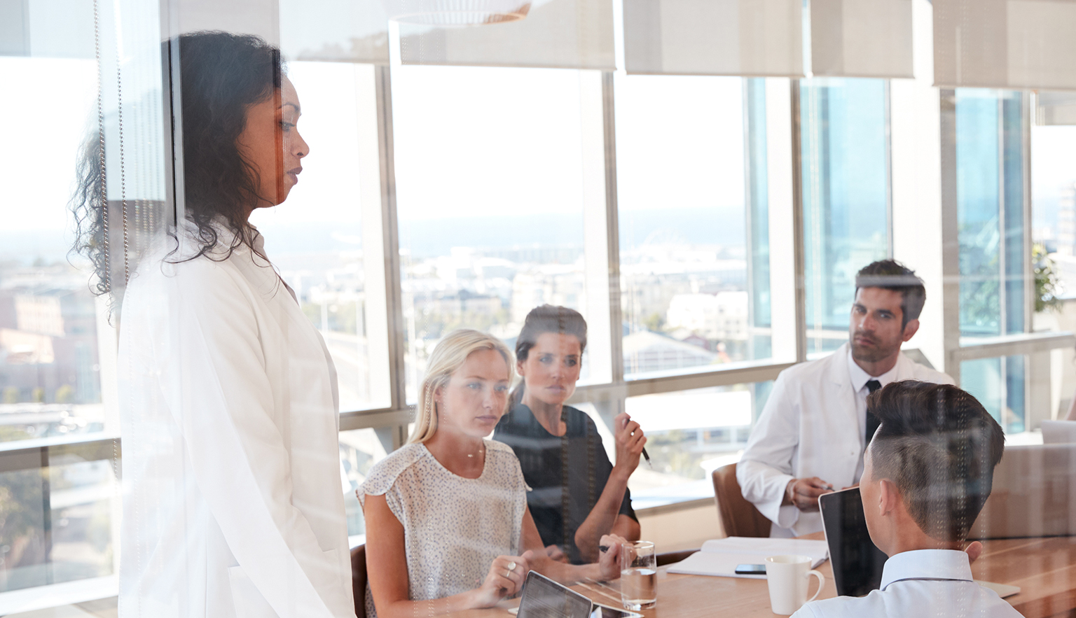 Healthcare workers meeting in a hospital meeting room