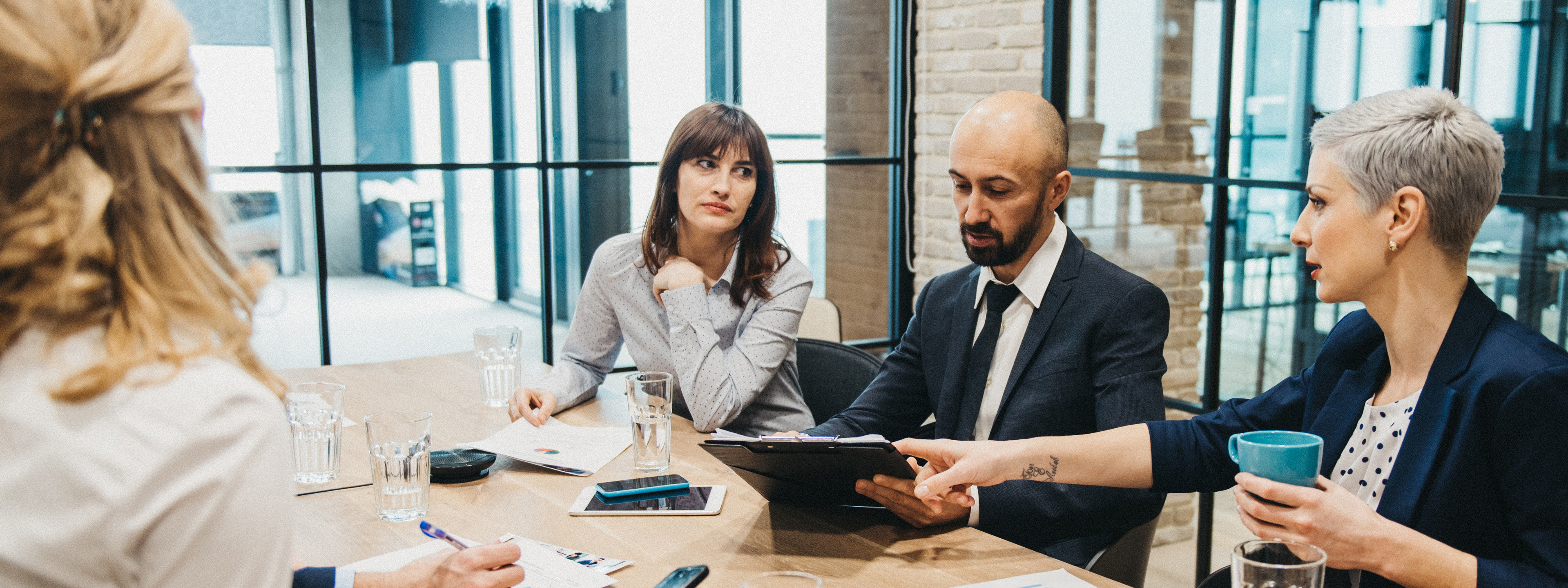 Coworkers discussing in a Board meeting 