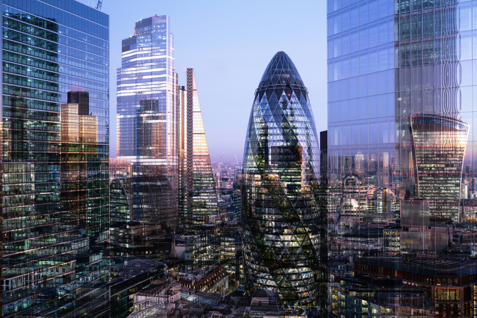 UK, London, multiple exposure, elevated view of high rise financial buildings in the city, illuminated at dusk