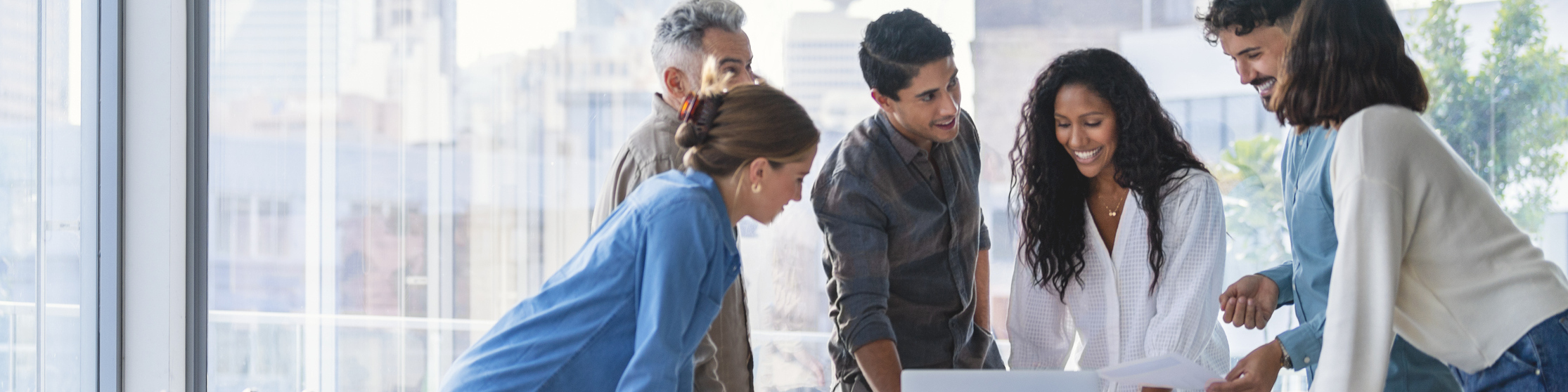 Team of business people working together in a board room