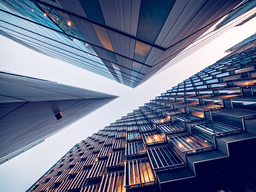 Looking directly up at the skyline of the financial district in central London,