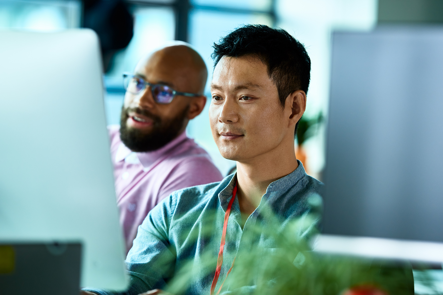 Man of Asian Ethnicity working with African American