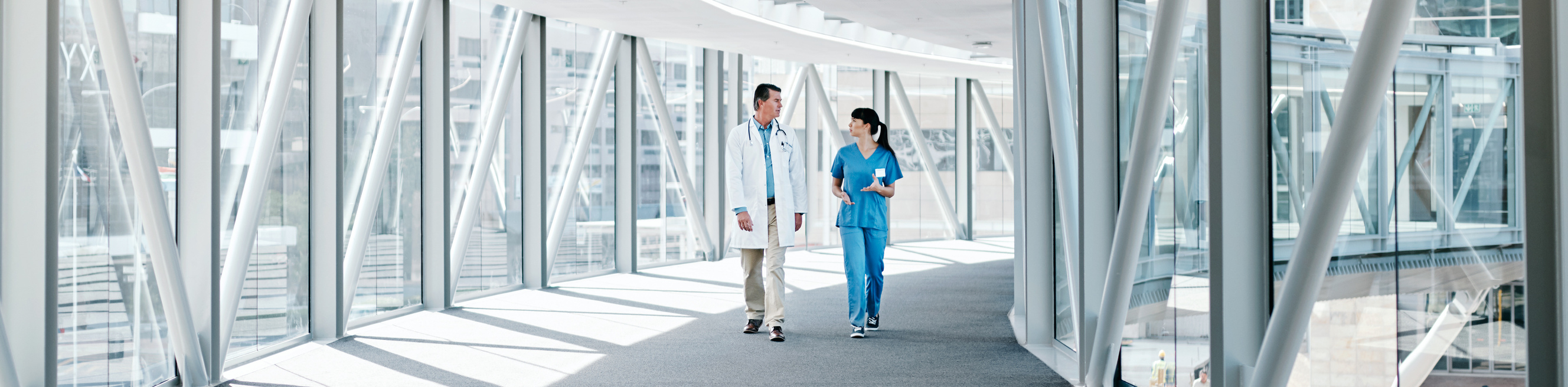 Shot of two healthcare workers walking together