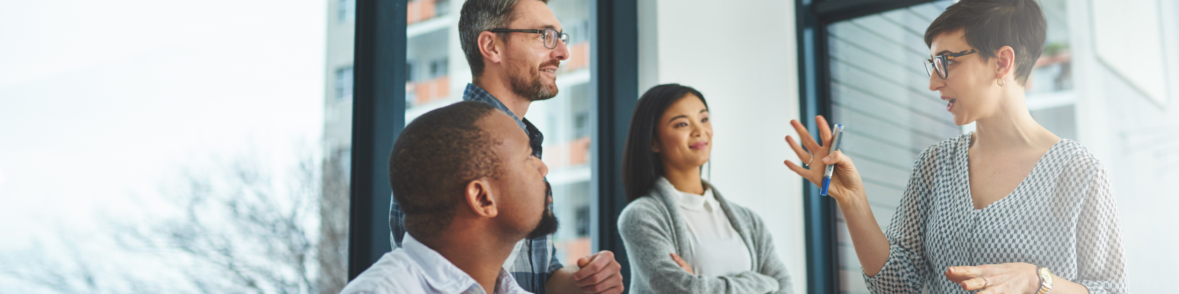 Multiracial employees discussing in a boardroom