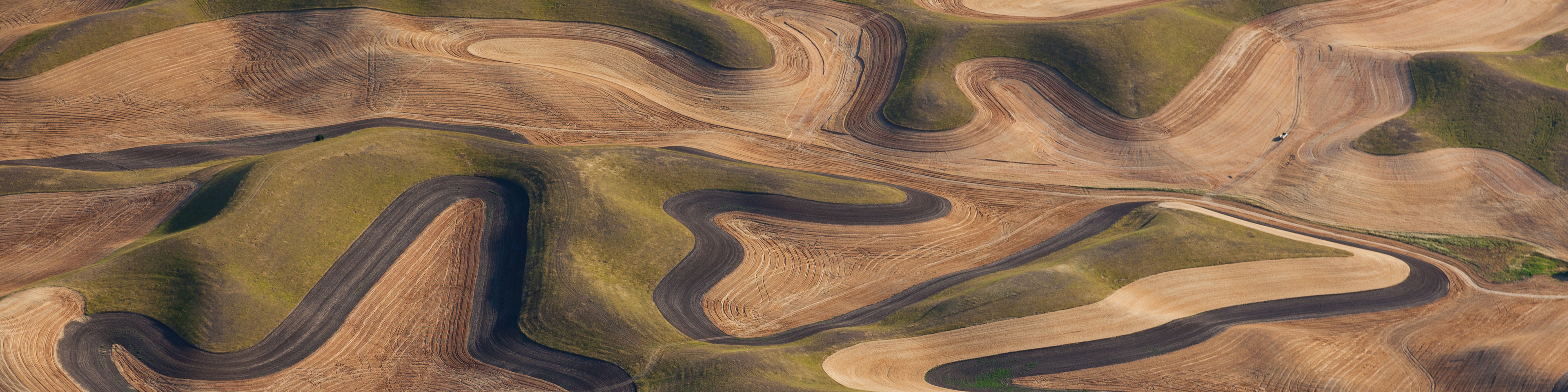Farmland landscape, with ploughed fields and furrows in Palouse, Washington, USA. An aerial view with natural patterns,