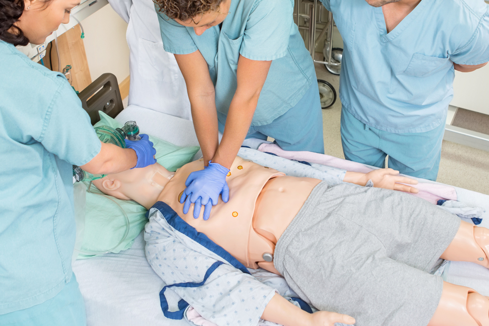 Nurses performing CPR on dummy patient