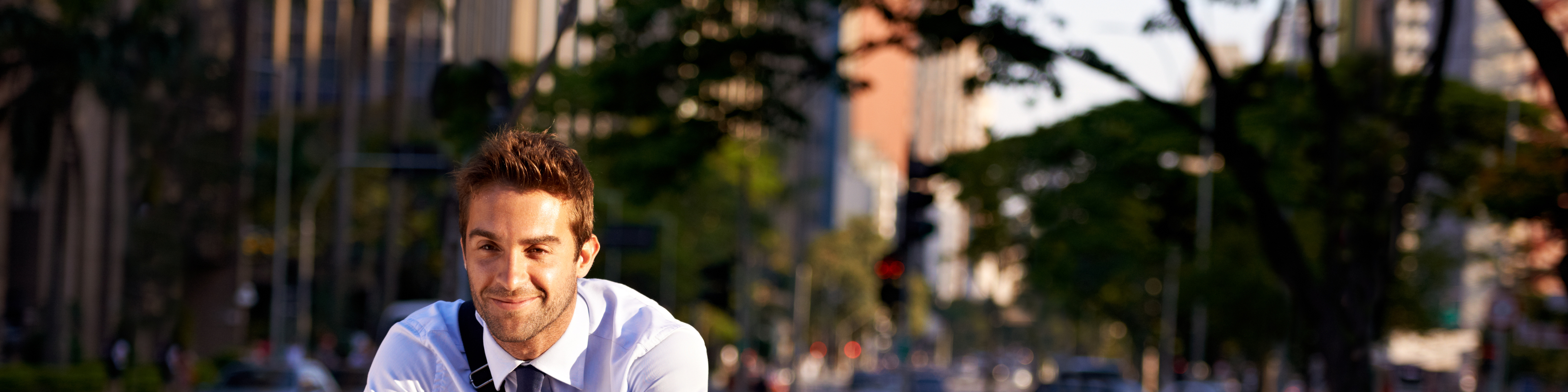 Shot of an attractive young man on his morning bicycle commute to work