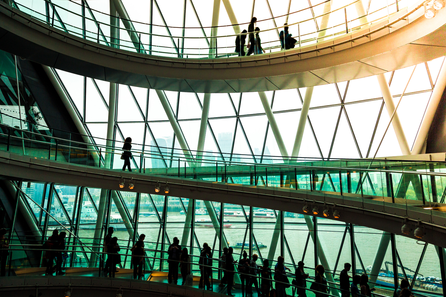 Abstract modern architecture and silhouettes of people on spiral staircase