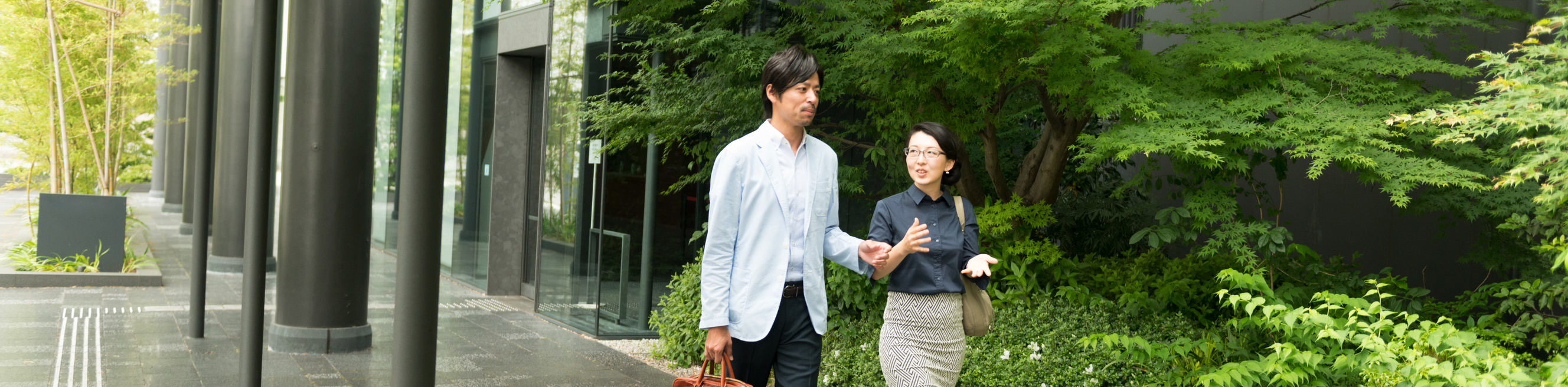 Japanese Business Professionals Walking and Talking In Kyoto Office Building