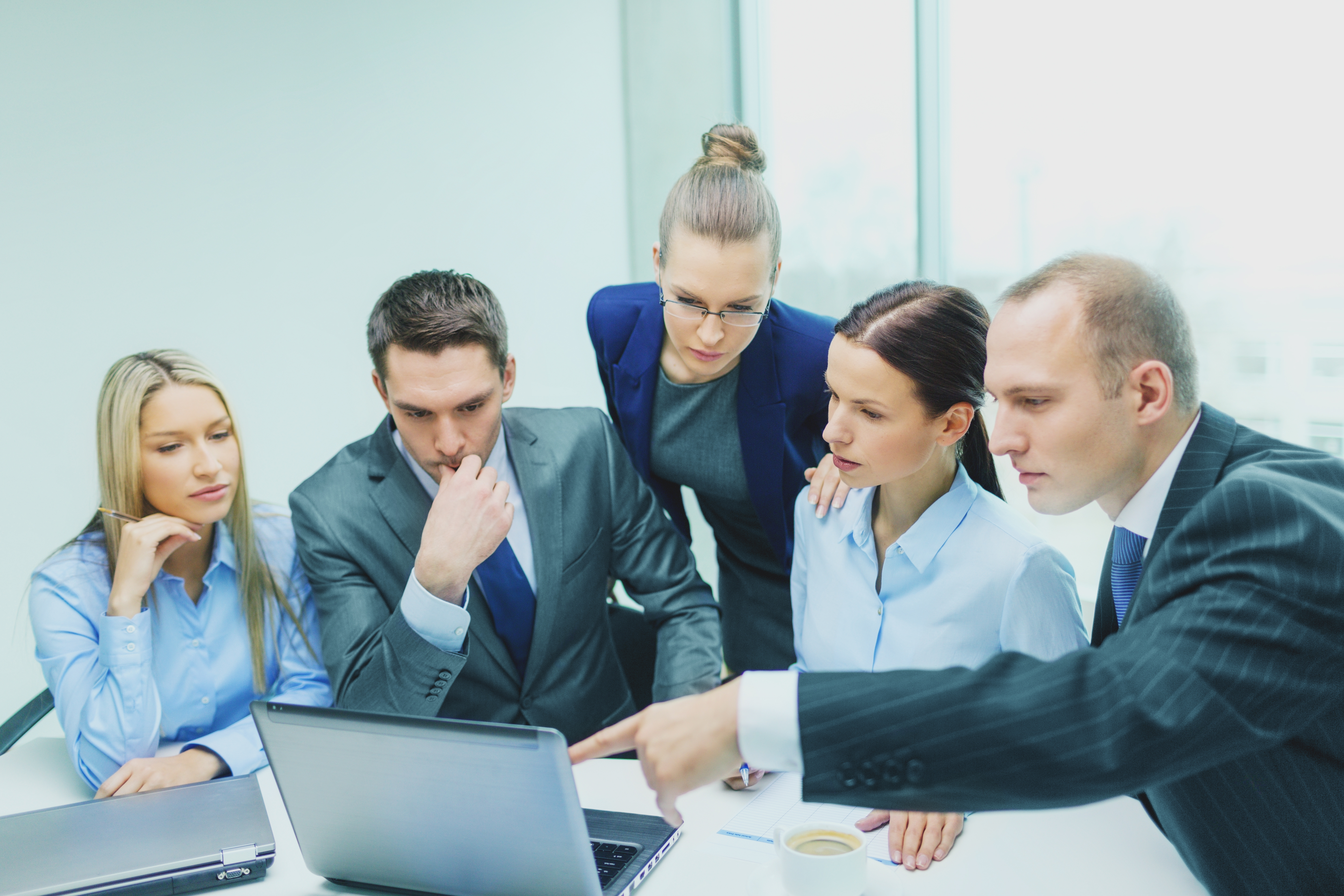 Concerned business people looking at something