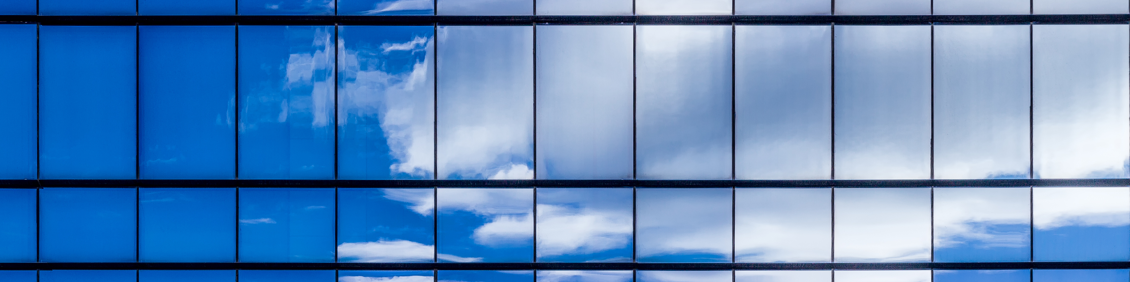 Reflections of clouds in skyscrapers