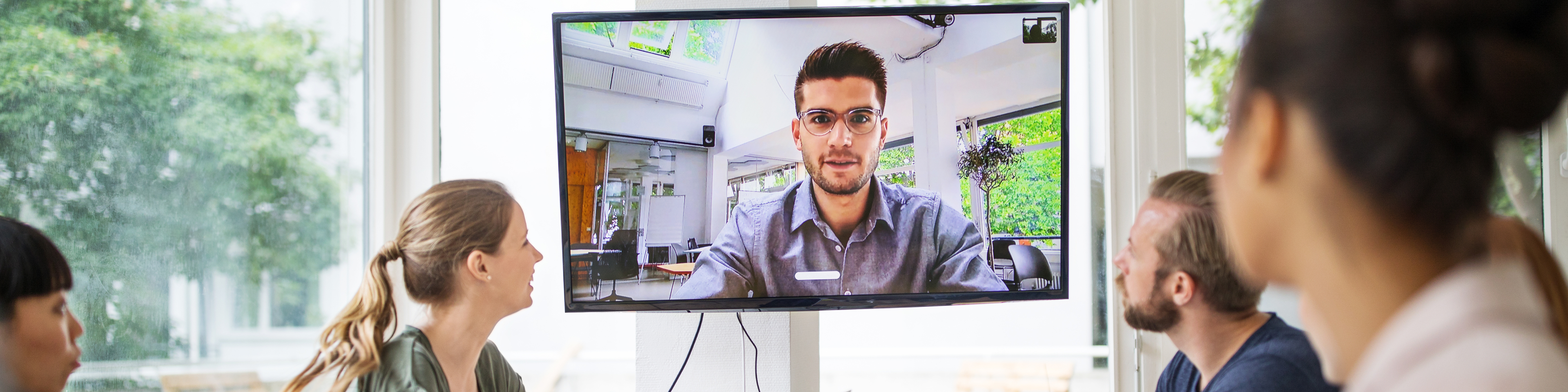 Startup business team having a video conference with investor