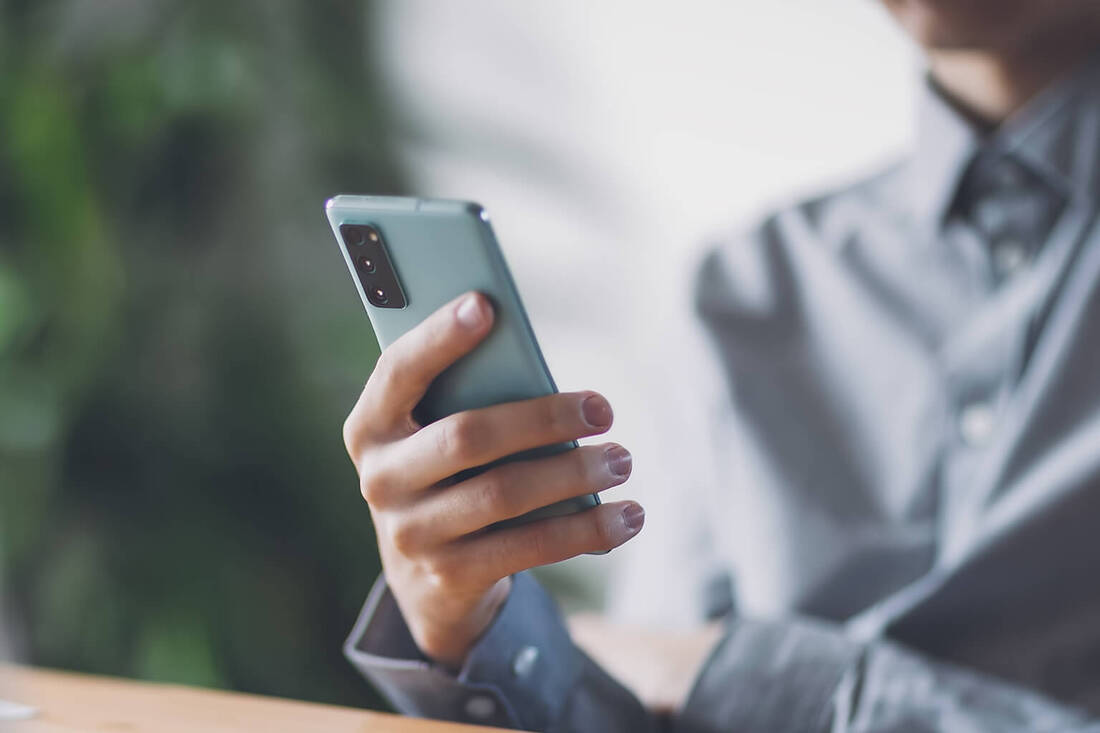 A man looking at a smartphone