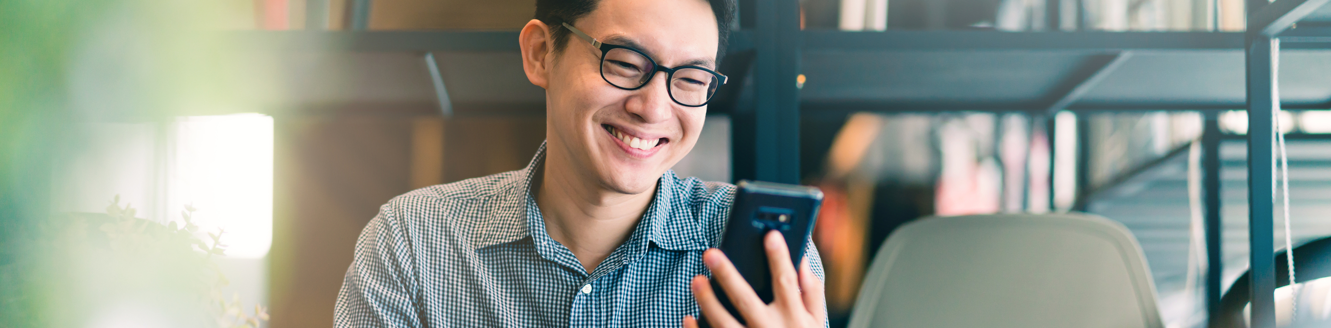 Smart confidence asian startup entrepreneur business owner businessman smile hand use smartphone woking in office background