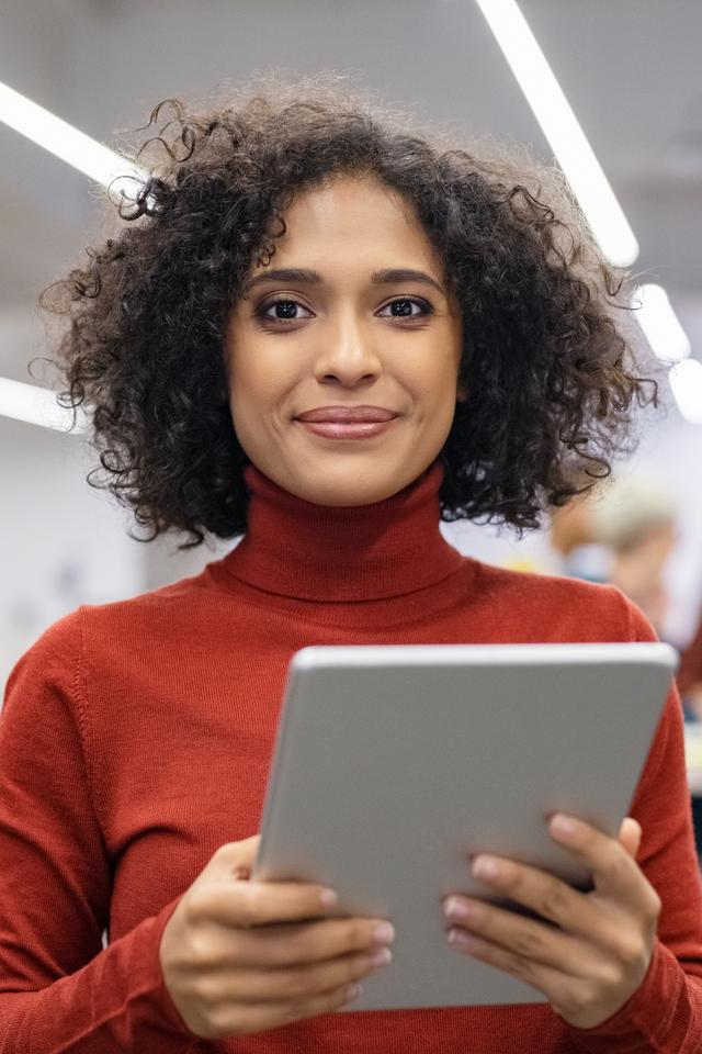 Mixed race young woman using digital tablet 