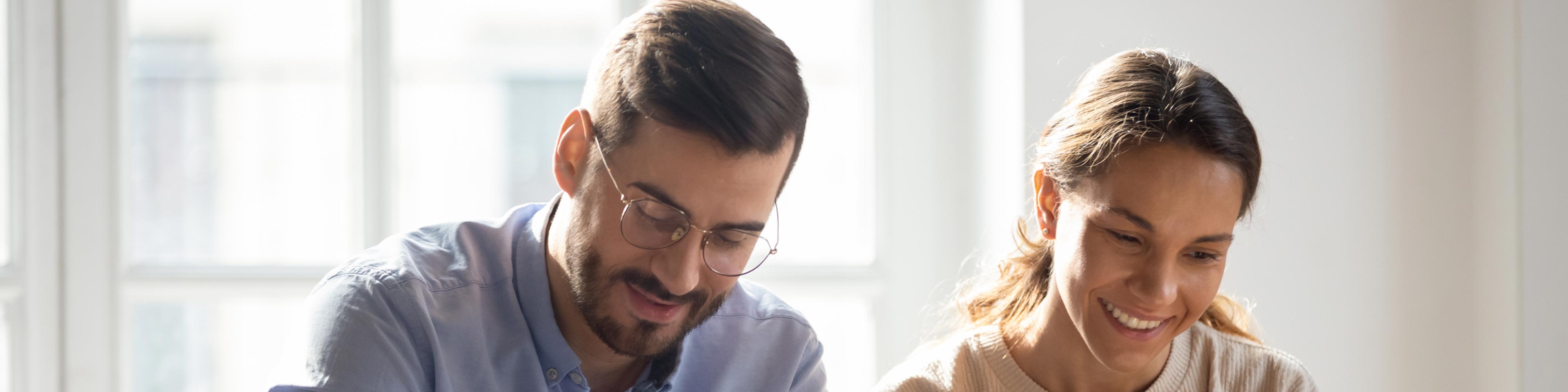 woman and man smiling at work