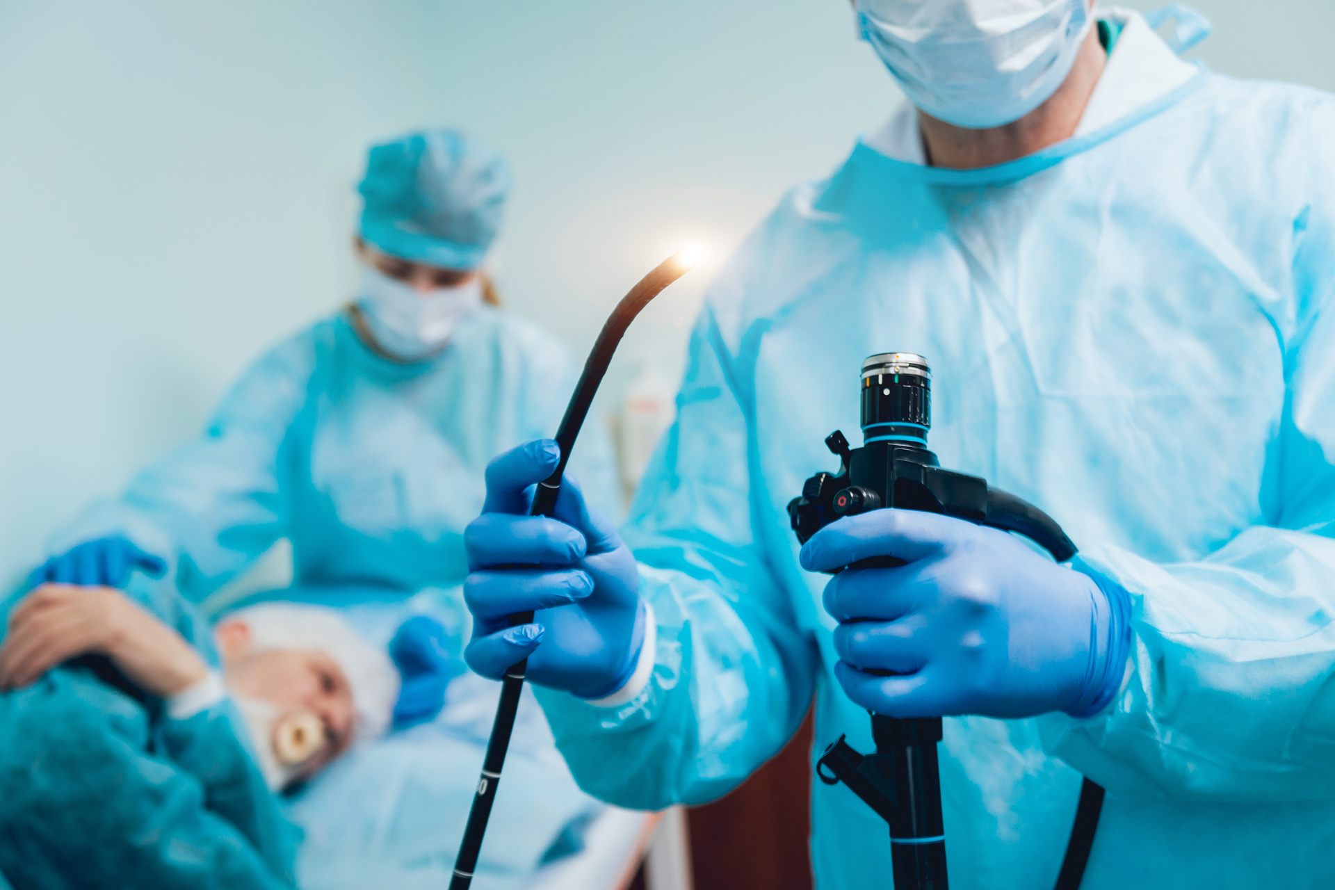 Doctor holding endoscope before gastroscopy