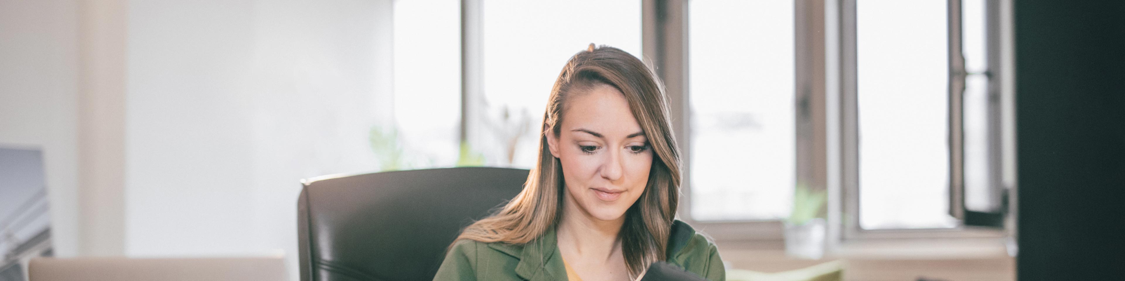 businesswoman sitting at her desk