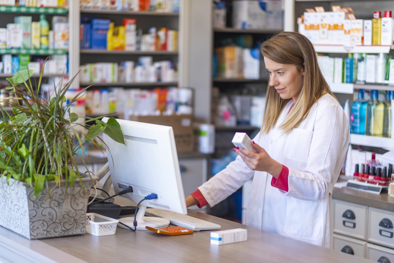 Pharmacist on a computer