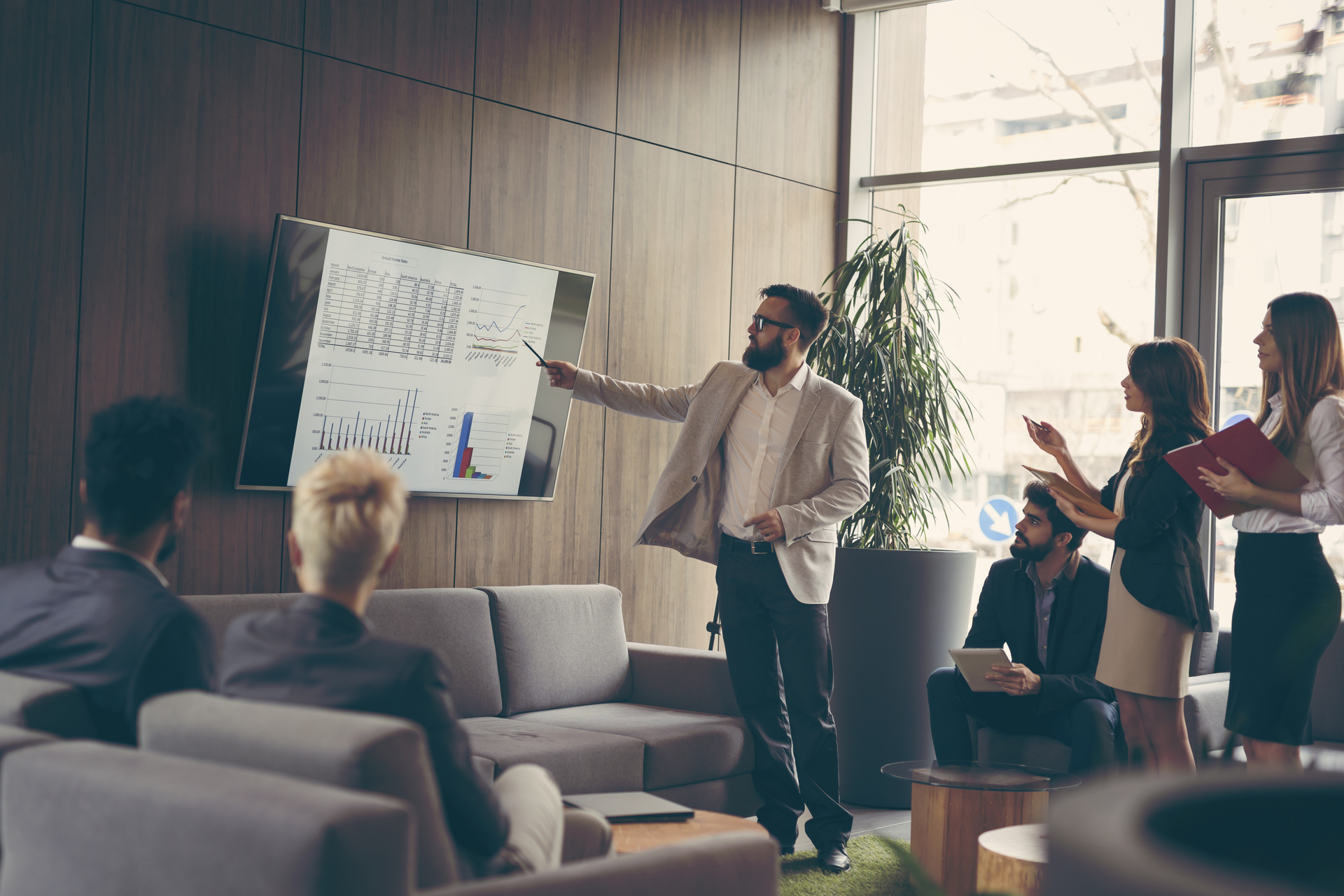 Business team on a morning briefing; business meeting and presentation in a modern office