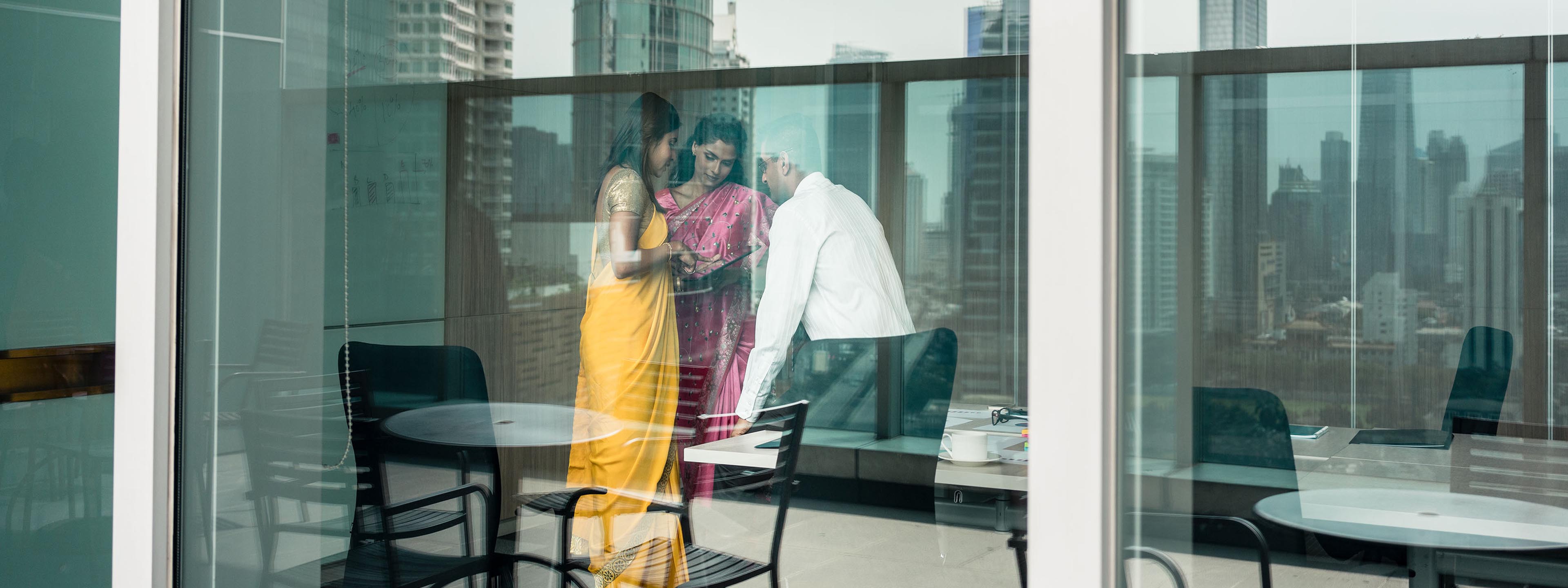 three people meet in office