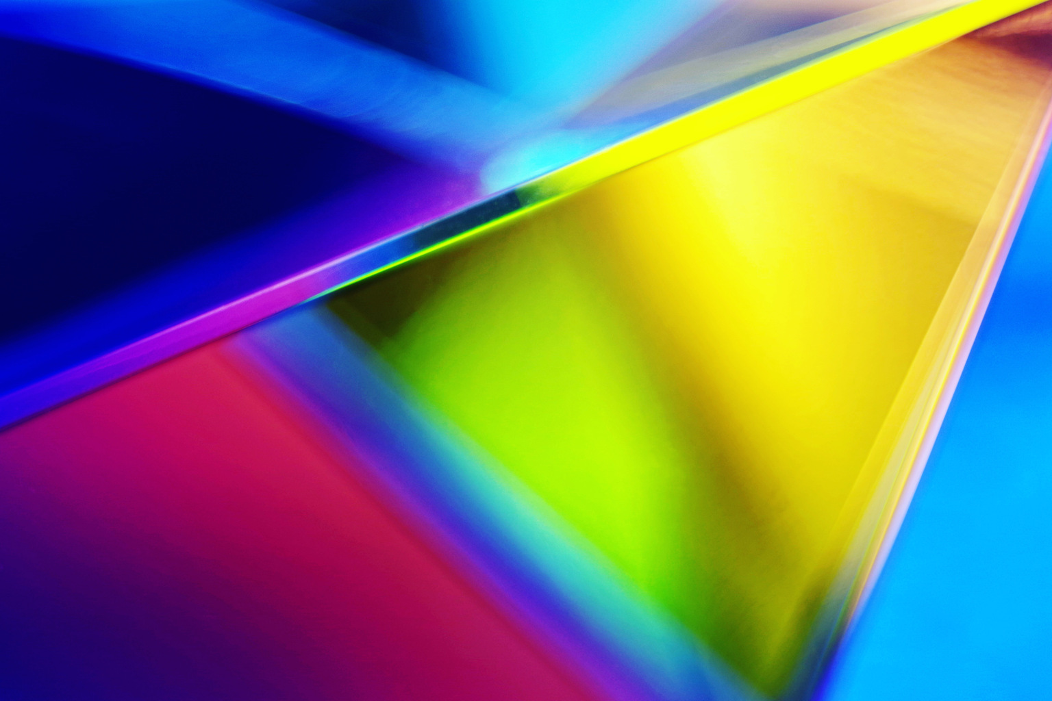 Triangular shaped glass prism with vibrant colorful light effects