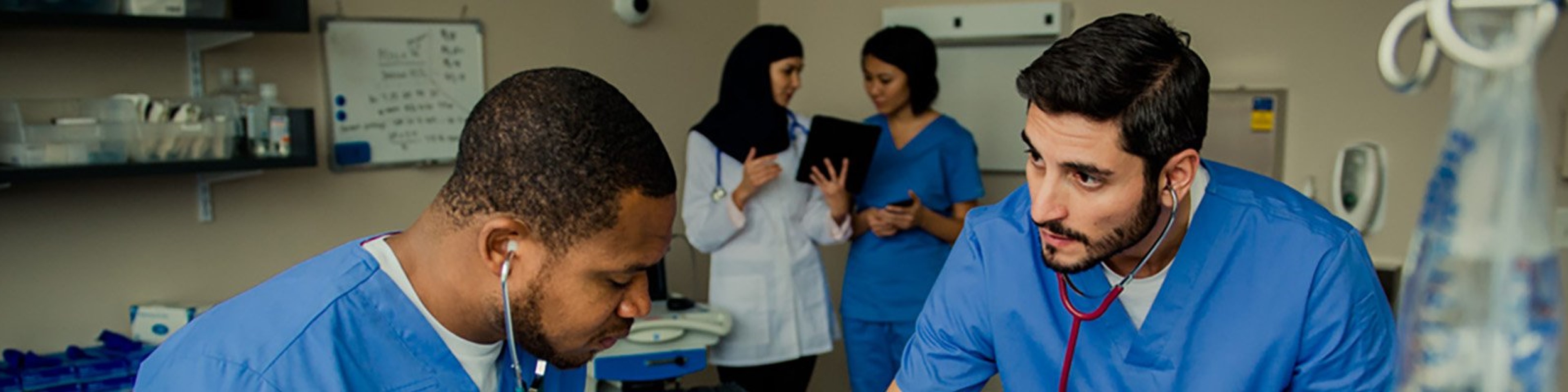 Doctors and nurses examining a patient