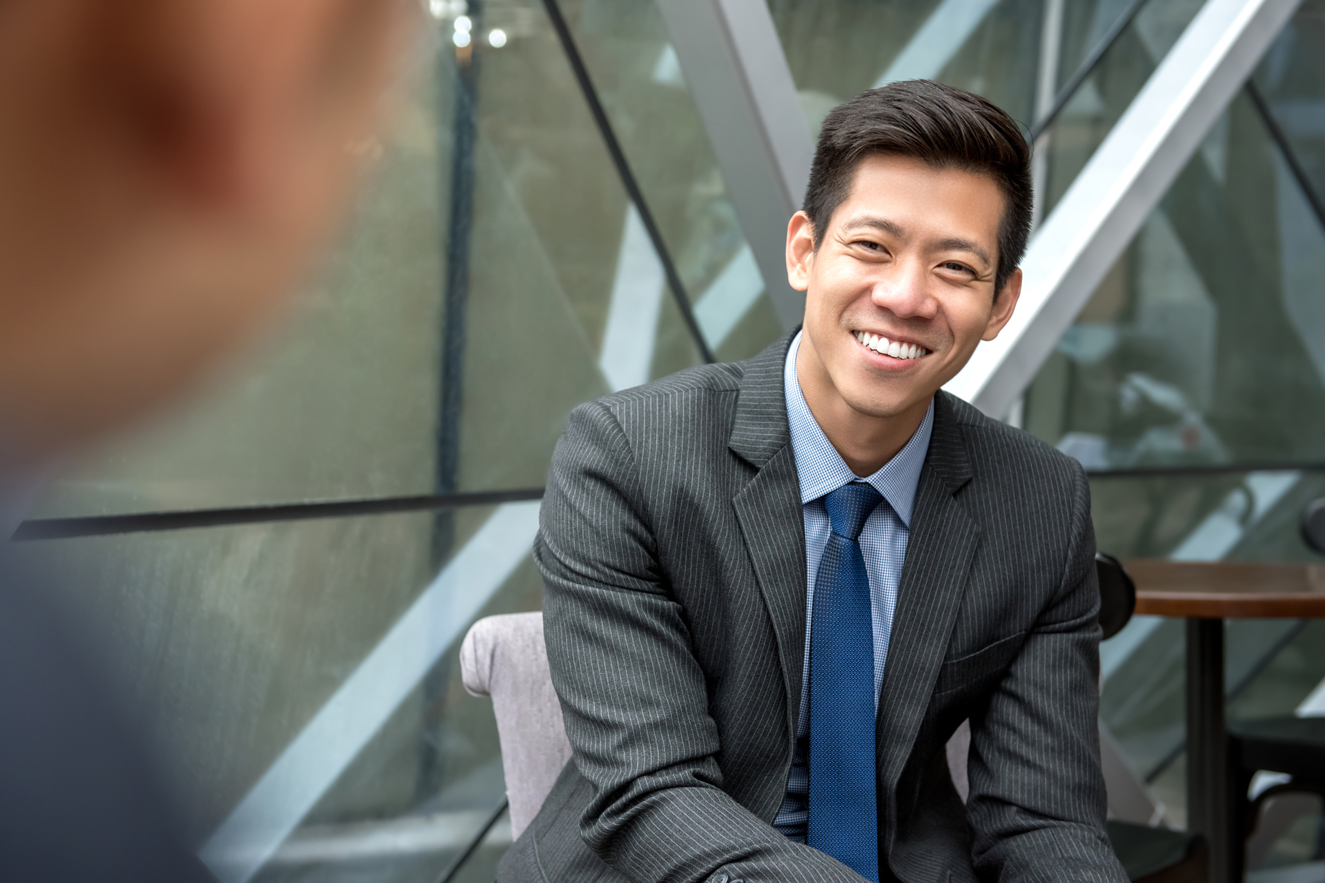 Asian businessman sitting at office lounge