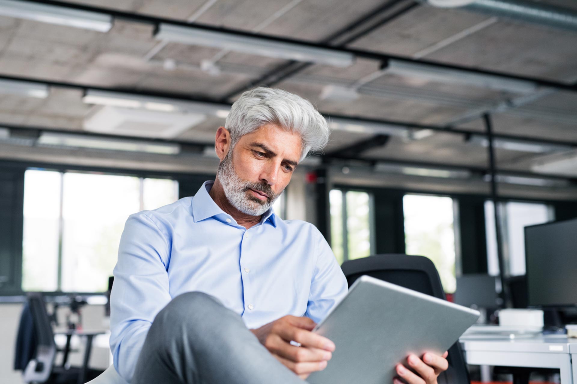 Man changing his business entity type on his tablet