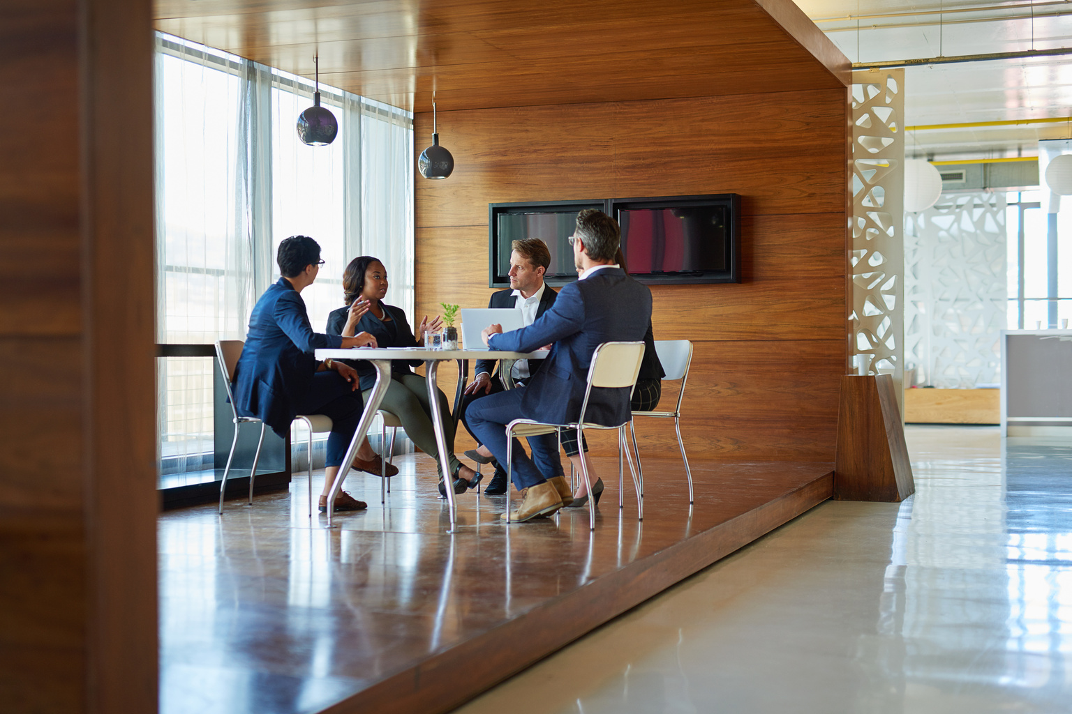 Group of corporate businesspeople working in the boardroom