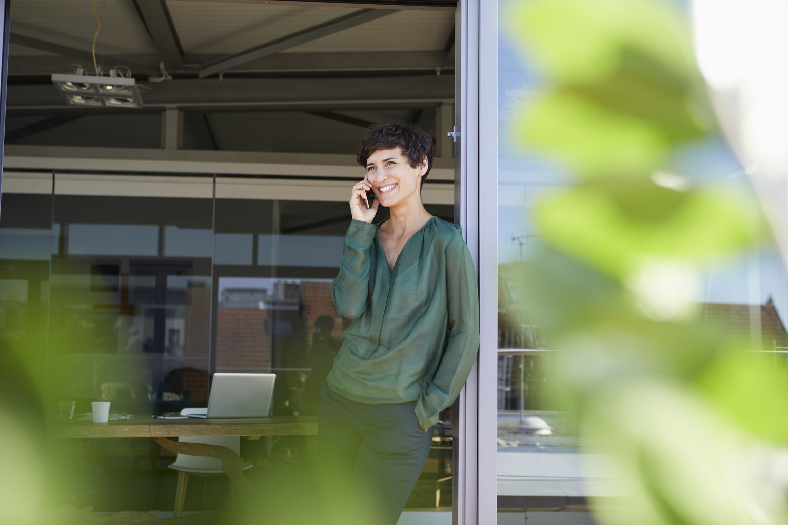 Woman Smiling and Talking on the Phone