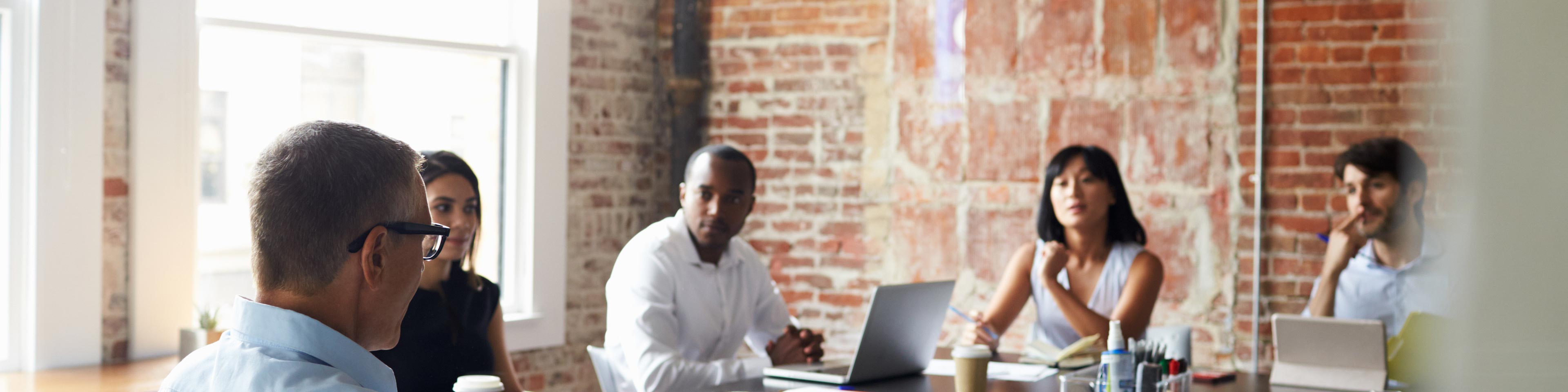 people sitting around a table working