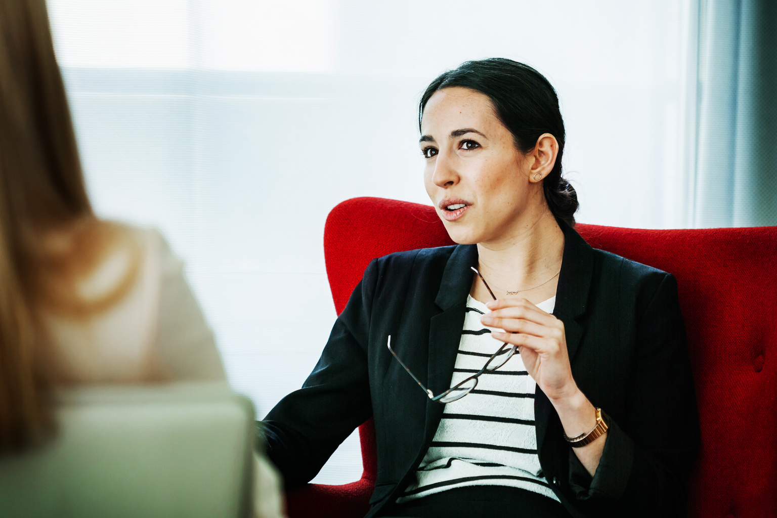 Young Businesswoman In Discussion With Her Colleague 