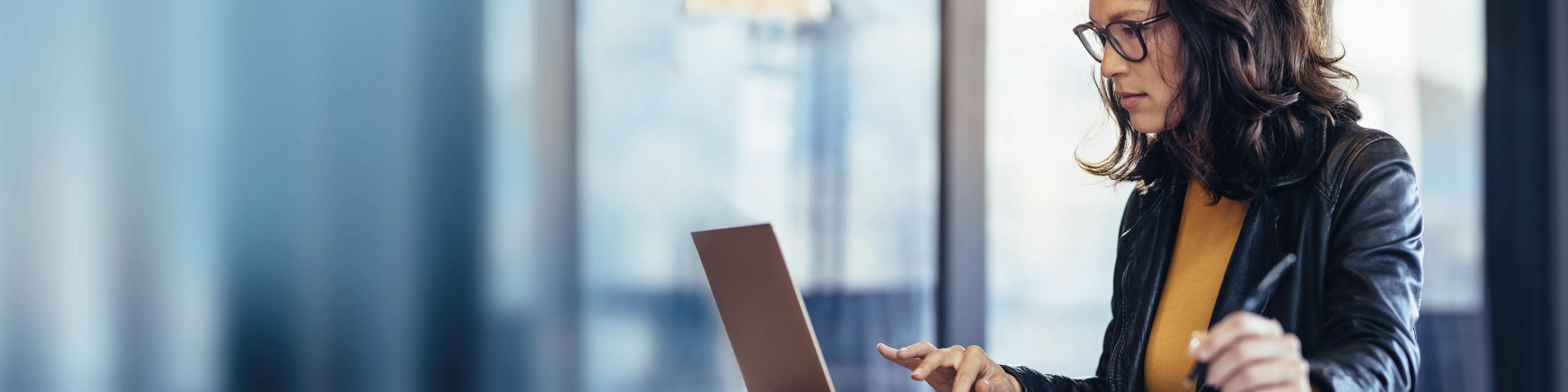 Wolters Kluwer woman working computer