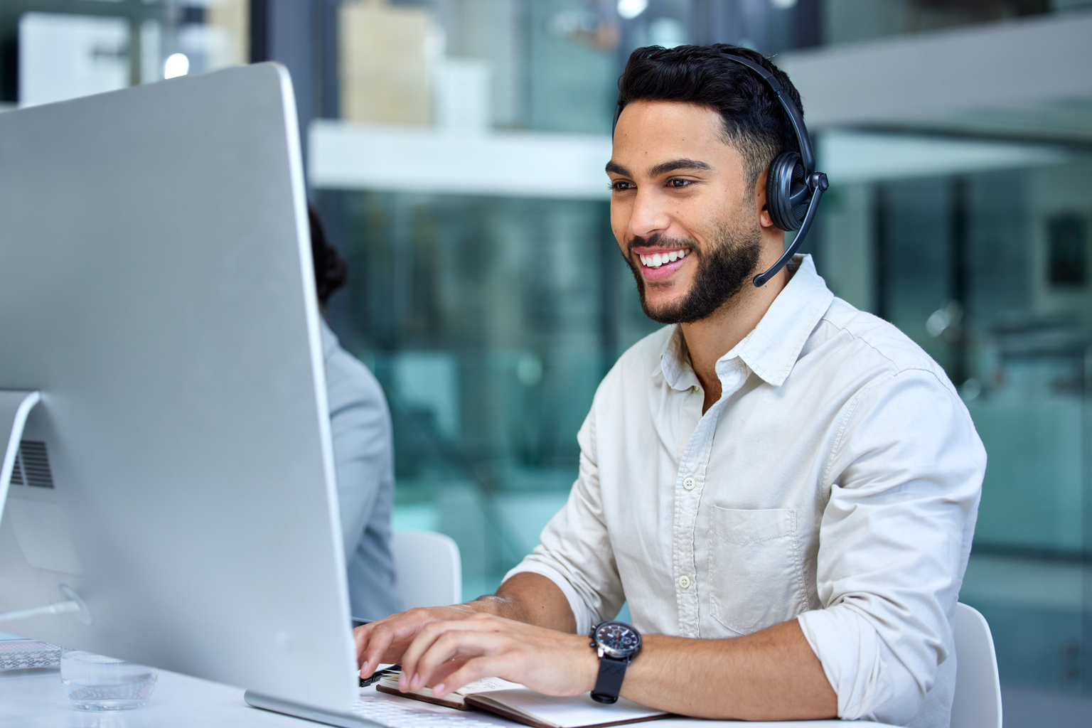 Business Person on headset call with client.